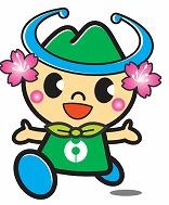 緑色の帽子をかぶっていて、顔の両脇にピンクの花があって、緑の服をきて、両手を広げて歩いているキャラクターの画像